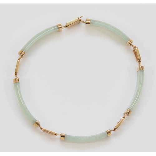 443 - A 9ct gold jadeite paneled bracelet, 19.5cm, 10.9gm.