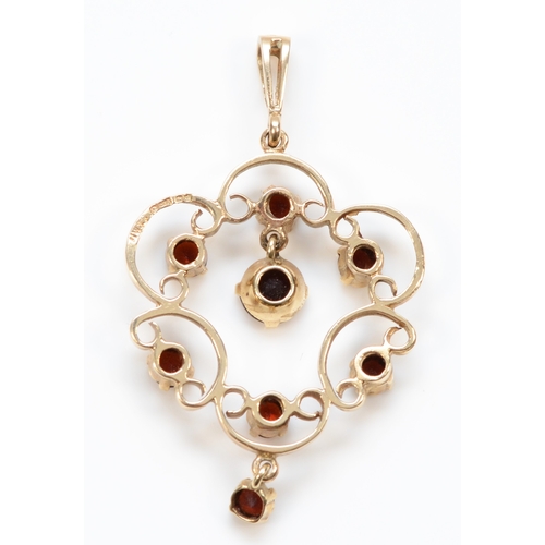 447 - A vintage 9ct gold garnet openwork drop pendant, 44mm, 4.3gm.