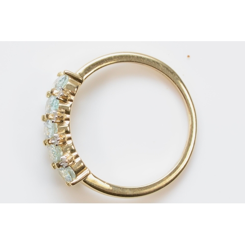 462 - A 9ct gold five stone aquamarine dress ring, with eight cut diamond accents, M, 1.7gm.