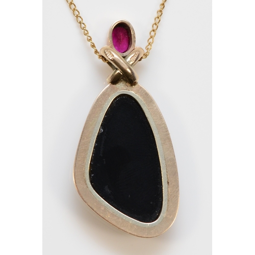 467 - A 9ct gold opal triplet and synthetic ruby pendant, on a 9ct gold chain, 41 x 19mm, 8.1gm.