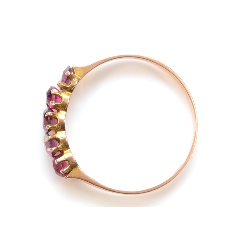 477 - A 9ct rose gold five stone garnet dress ring, Q-R, 1.4gm.