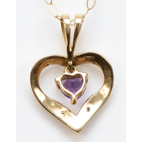 480 - A gold amethyst and eight cut diamond heart pendant, unmarked, on a 375 gold chain, 17 x 12mm,