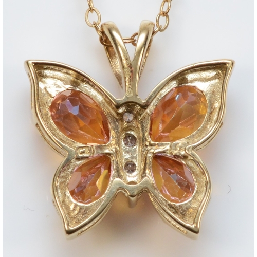 483 - A 9ct gold mystic topaz and cubic zirconia butterfly pendant, on unmarked chain, 17 x 16mm, 2.8gm.