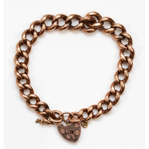 502 - A 9ct rose gold curb link heart padlock clasped bracelet, 47gm.