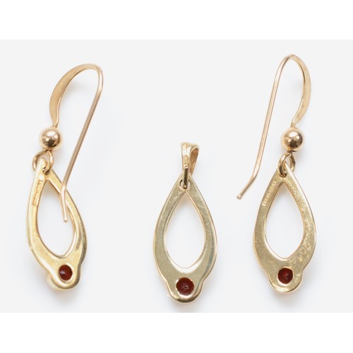 529 - A 9ct gold garnet drop pendant, 19 x 7mm, together with a pair of matching earrings, 2.2gm.