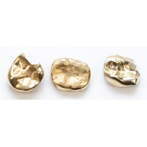 486 - Three gold dentistry crowns, 5.4gm.