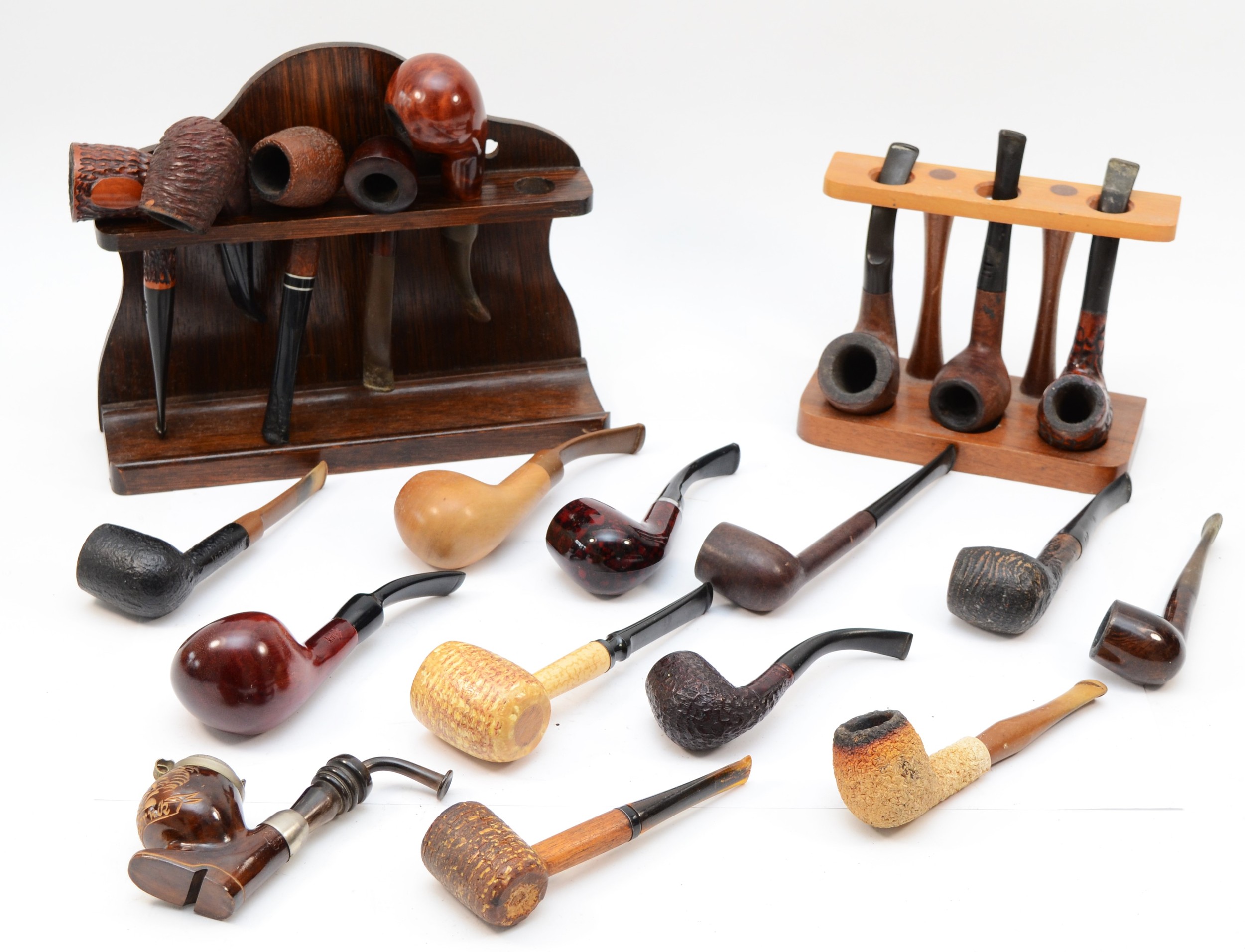 A collection of tobacco pipes, makers to include E.A Carey, Sharrow ...