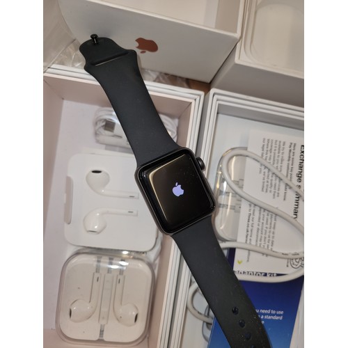 57 - An Apple Watch, series 3 with box and charger, together with a pair of Silvercrest blue tooth headph... 