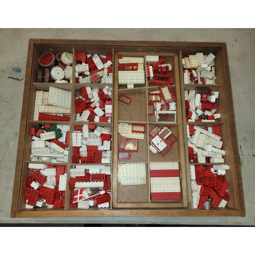 74 - A mid 20th century Lego 'System' pieces, in original pictorial wooden box.