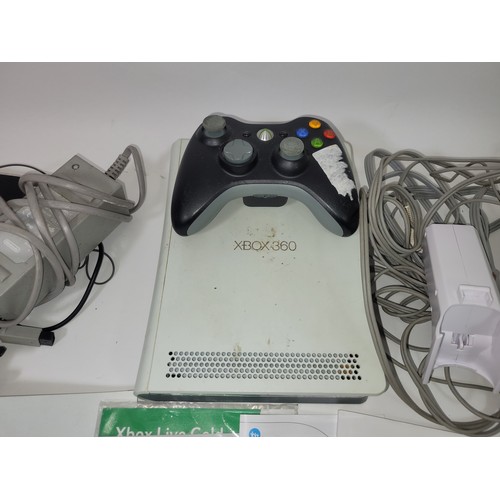 81 - An Xbox 360 games console, together with a quantity of unrelated games leads, power supplies and con... 