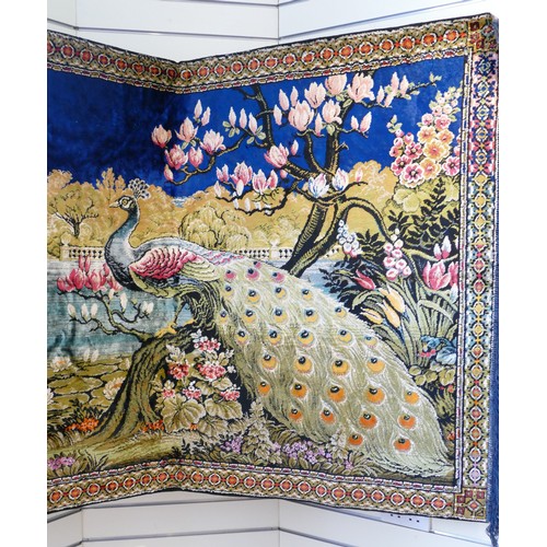 87 - A woven wall hanging featuring deer. 190 x 125cm. 
Together with a similar wall hanging featuring a ... 