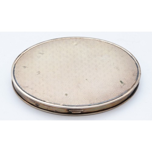 66 - A Swedish 830 standard oval powder compact, opening to reveal a mirror, 8 x 6 x 1cm, 73gms gross.