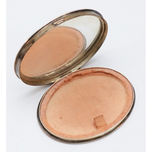 66 - A Swedish 830 standard oval powder compact, opening to reveal a mirror, 8 x 6 x 1cm, 73gms gross.