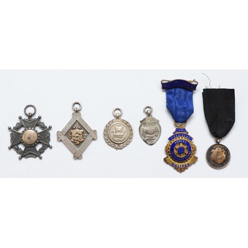 74 - Five silver watch fobs and a silver gilt and enamel Rotary International badge, 76gms