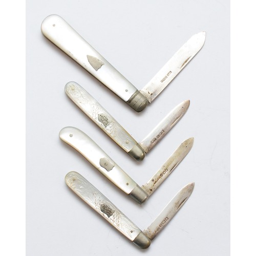 81 - Four silver bladed and mother of pearl fruit knives, various dates