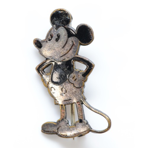 185 - Charles Horner, a white metal and black enamelled brooch/badge in the form of Mickey Mouse with make... 