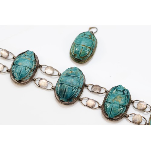 186 - A low grade silver and faience scarab beatle bracelet, 17cm, together with a matching pendant.