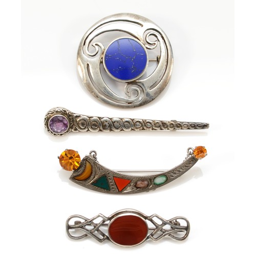 213 - A Scottish silver and hardstone crescent brooch and three other Celtic designed brooches, 47gm