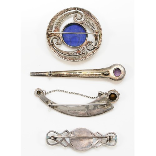 213 - A Scottish silver and hardstone crescent brooch and three other Celtic designed brooches, 47gm