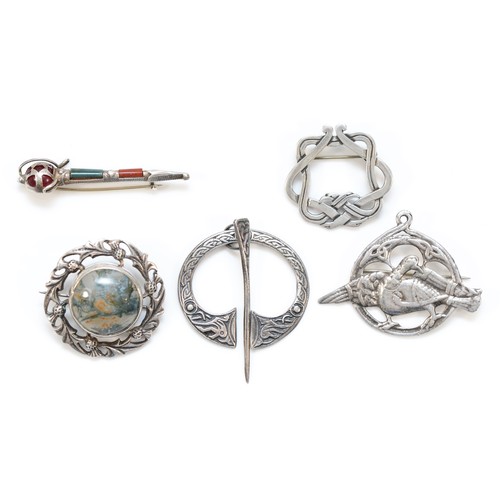 216 - A Scottish silver and agate Dirk brooch, 50mm, and four other Celtic brooches