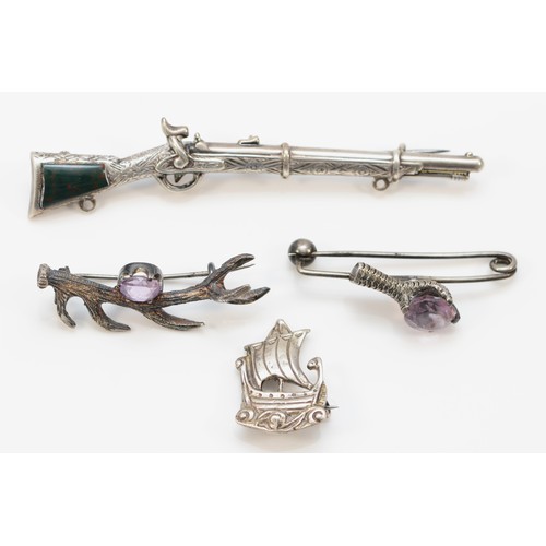 218 - A Victorian unmarked silver and bloodstone musket brooch, 9cm, two silver and amethyst animal brooch... 