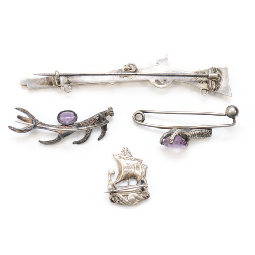 218 - A Victorian unmarked silver and bloodstone musket brooch, 9cm, two silver and amethyst animal brooch... 