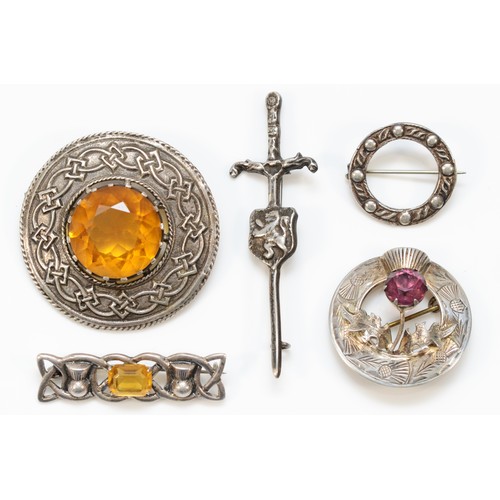 224 - Robert Allison, a Scottish sword and sheild brooch, Glasgow 1957, and four other Scottish brooches, ... 