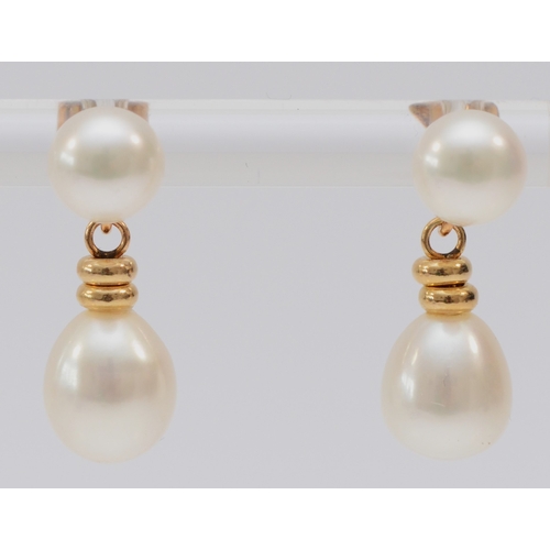 238 - A 14K gold mounted pair of cultured pearl ear drops, 19mm