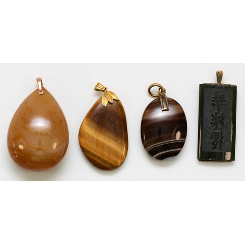 240 - A 9ct gold mounted carved nephrite jade pendant, 48mm and three 9ct gold mounted hardstone pendants ... 