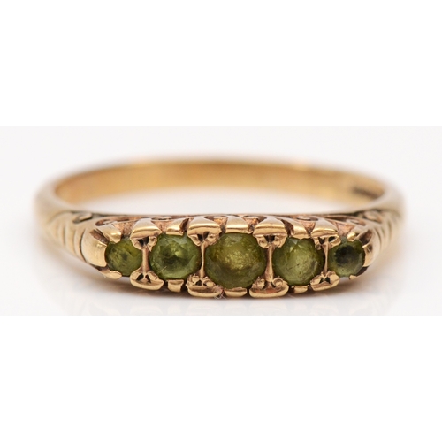 243 - A vintage 9ct gold five stone peridot ring, W, 3.7gm