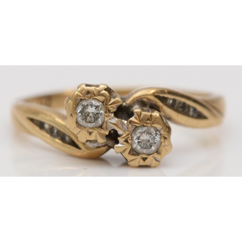 245 - A 9ct gold two stone brilliant cut diamond crossover ring, stated weight 0.17cts, J, 1.8gm