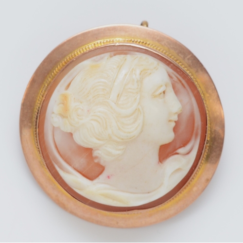 262 - A 9ct rose gold mounted shell cameo brooch, diameter 30mm, 8.4gm