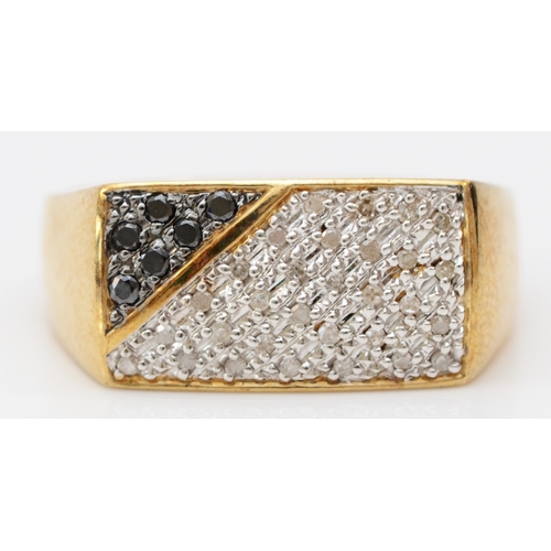 263 - A 9ct gold white and black diamond panel ring, 18 x 10mm, V, 6.9gm