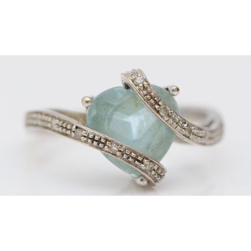 264 - A 9ct white gold heart shape topaz and diamond dress ring, N, 3gm