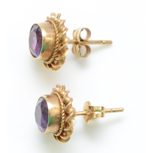 282 - A 9ct gold pair of amethyst ear studs, 1.7gm