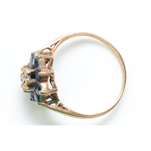 318 - A 9ct gold sapphire and diamond cluster ring, O, 2.4gm