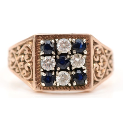 431 - An unmarked 9ct rose gold, sapphire and white stone checkerboard panel ring, S, 4.5gm.