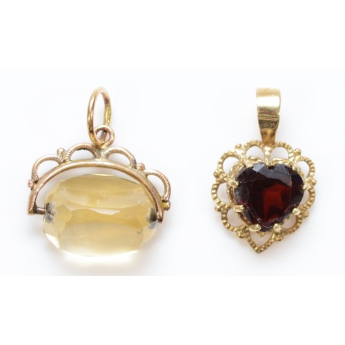 437 - An unmarked gold garnet heart shape pendant,16mm and an unmarked gold swivel seal, 2.4gm