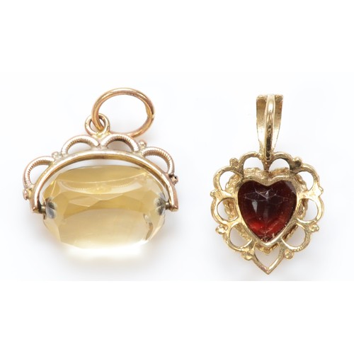 437 - An unmarked gold garnet heart shape pendant,16mm and an unmarked gold swivel seal, 2.4gm