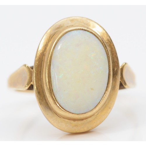 444 - A 9ct gold and opal panel ring, stone, 14 x 9mm, R, 5.1gm, good colour play, surface abrasions, woul... 