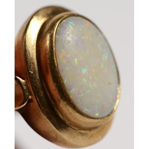 444 - A 9ct gold and opal panel ring, stone, 14 x 9mm, R, 5.1gm, good colour play, surface abrasions, woul... 