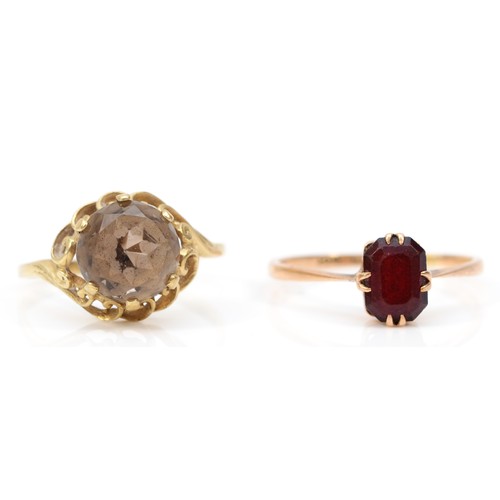 445 - A 9ct gold and garnet dress ring, R and a 9ct gold and quartz dress ring, O, 4.1gm