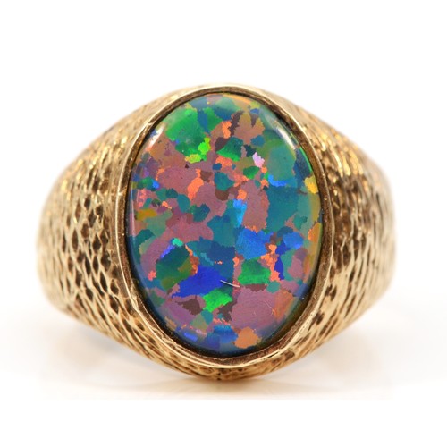 451 - An unmarked 9ct gold and black opal doublet/triplet gentleman's signet ring, stone 18 x 14mm, textur... 