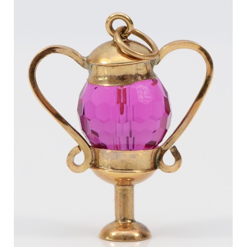 452 - A 9ct gold and amethyst glass urn shape charm, 25mm, 4.4gm