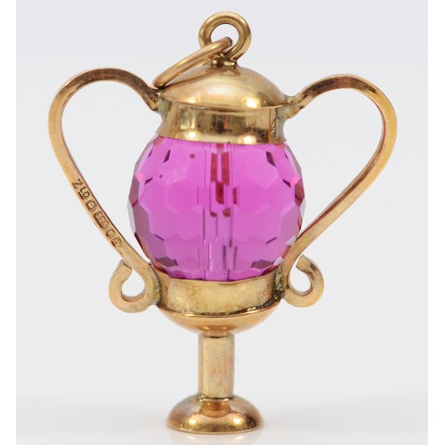 452 - A 9ct gold and amethyst glass urn shape charm, 25mm, 4.4gm