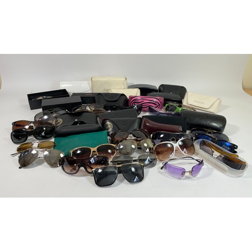 248 - A large collection of ladies and gents fashion sunglasses, cased and loose.