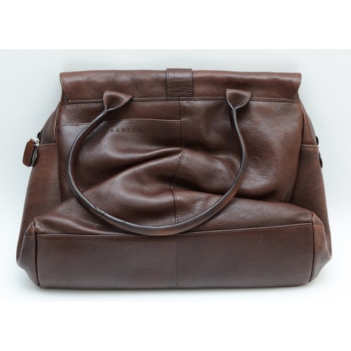 252 - Radley, brown leather shoulder bag with cotton lining, push through front fastening behind twisted l... 