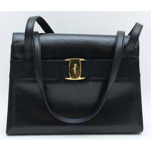 253 - Salvatore Ferragamo labelled, black, Gancini top handle belt feature style handbag, material lined, ... 