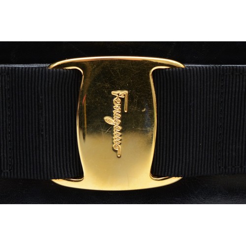 253 - Salvatore Ferragamo labelled, black, Gancini top handle belt feature style handbag, material lined, ... 