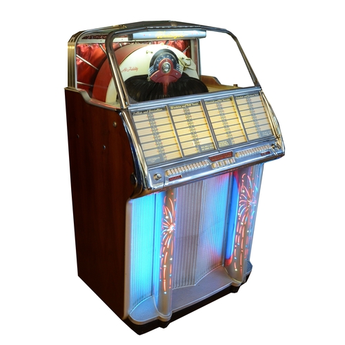 A Wurlitzer Model 1800 Multi-Selector Phonograph jukebox, c.1955, serial no. 235199, with Cobra Radionic tone arm by Zenith Radio Corp. of Chicago, finished in blue, red, white and chrome, with 1960s period 45rpm singles, 83 x 140 x 70cm, in good cosmetic condition, one replacement pilaster, one cracked, working but will need tuning and adjustment before regular use.